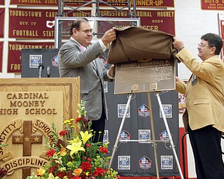        ROBERT K. YOSAY  | THE VINDICATOR..Mr D and Dave Baker  President of the HOF....uncover the placque. at the Eddie DeBartolo HOF plaque unveiling at Cardinal Mooney High School....... - -30-