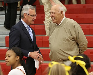        ROBERT K. YOSAY  | THE VINDICATOR..YSU president Jim Tressel and former Head Coach Don Bucci share a moment at the Eddie DeBartolo HOF plaque unveiling at Cardinal Mooney High School.... - -30-
