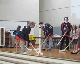 Neighbors | Alexis Bartolomucci.Youngstown Phantoms players visited Dobbins Elementary and played floor hockey with them on Sept. 20.