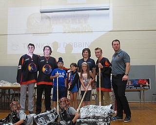Neighbors | Alexis Bartolomucci.Some of the Dobbins students stood with the Phantoms players, Assistant Coach Tom Upton and Jennifer Johnson of Aqua Ohio on Sept. 20 after playing a game of floor hockey.