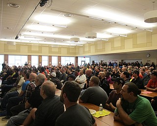 Neighbors | Alexis Bartolomucci.The fathers, grandfathers, uncles and other father-figures who attended the WATCH D.O.G.S. kick off event at Austintown Intermediate School on Sept. 26 watched a short video to learn about the program.