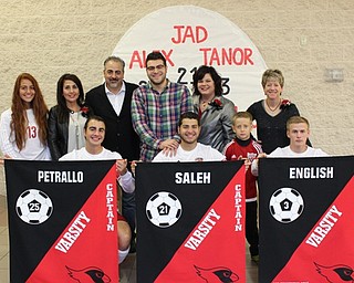Neighbor | Abby Slanker.The three Canfield High School boys soccer team seniors were joined by their families while being honored during Senior Night Sept. 29. Senior soccer team member Alex Petrallo, front left, was joined by his sister Julia and his parents Stella and Scott Petrallo, back left to right. Senior soccer team member Jad Saleh, front center, was joined by his brother Maleck and mother Heidi Saleh, back center. Senior soccer team member Tanor English, right, was joined by his brother Tristan and his mother Heather English, back right.