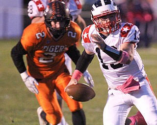 William D. Lewis/The Vindicator Niles' Tlyer Skrbinovich(13) is chased by Howland's George Beatty-Marsh(2) during Oct 13, 2016 action at Howland.
