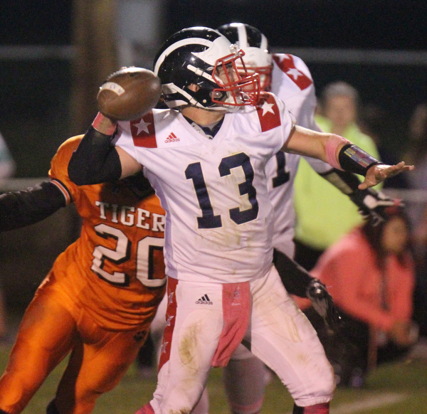 William D. Lewis/The Vindicator Niles' Tlyer Skrbinovich(13) is chased by Howland's Victor Williams(20) during Oct 13, 2016 action at Howland.