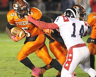 William D. Lewis/The Vindicator Howland's Tariq Ellis(5) is chased by NilesRicky Palmer(14) during Oct 13, 2016 action at Howland.