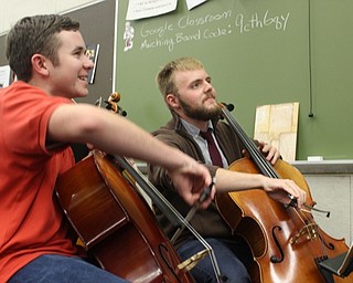 Neighbors | Submitted.Wyatt Miller and Simon Pusateri are pictured practicing their instruments for the Boardman Hugh School orchestra concert.