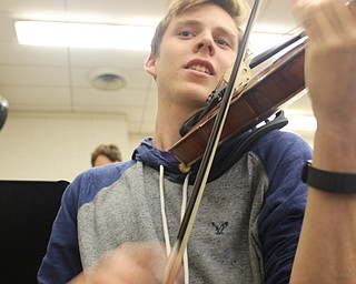 Neighbors | Submitted.Pictured is Jacob Smotzer playing his violin for the upcoming concert.