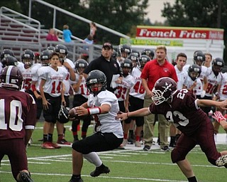 Neighbors | Submitted.Eighth-grader Ethan Fletcher wraps up a Boardman runner.