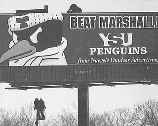GO YSU-A BILLBOARD BEING ERECTED AT MARTIN LUTHER KING BLVD. AND THE MADISON AVE. FREEWAY BY STEVE SAVICK OF NILES(LEFT) AND HARMON WOLFE OF LIBERTY, BOTH WHO WORK FOR NAEGELE SIGN COMP. THE PICTURE WAS SHOT FROM RAYEN AVE. IN YOUNGSTOWN. 12/18/91