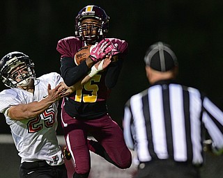 LIBERTY, OHIO - OCTOBER 13, 2016: Quaishon Campbell #15 of Liberty intercepts a pass in the end zone intended for Jeremiah Knight #25 of Jefferson during the first half of their game Thursday night at Liberty High School. DAVID DERMER | THE VINDICATOR