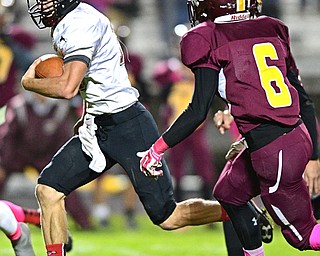 LIBERTY, OHIO - OCTOBER 13, 2016: JJ Henson #10 of Jefferson runs in the open field while being chased by David Hunt #6 of Liberty during the first half of their game Thursday night at Liberty High School. DAVID DERMER | THE VINDICATOR