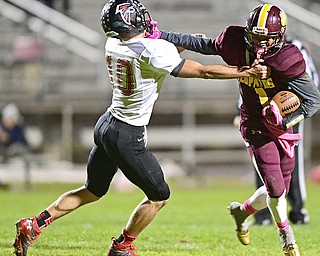 LIBERTY, OHIO - OCTOBER 13, 2016: Dra Rushton #1 of Liberty fights unsuccessfully to avoid being sacked by JJ Henson #10 of Jefferson during the first half of their game Thursday night at Liberty High School. DAVID DERMER | THE VINDICATOR