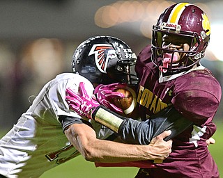 LIBERTY, OHIO - OCTOBER 13, 2016: Dra Rushton #1 of Liberty is wrapped up by JJ Henson #10 of Jefferson during the first half of their game Thursday night at Liberty High School. DAVID DERMER | THE VINDICATOR