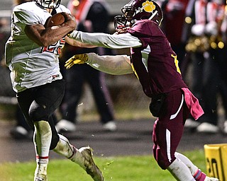 LIBERTY, OHIO - OCTOBER 13, 2016: Jeremiah Knight #25 of Jefferson is forced out of bounds by Capone Haywood #2 of Liberty during the first half of their game Thursday night at Liberty High School. DAVID DERMER | THE VINDICATOR