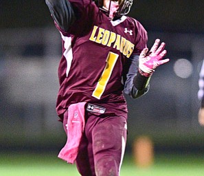 LIBERTY, OHIO - OCTOBER 13, 2016: Dra Rushton #1 of Liberty throws a pass on the run during the first half of their game Thursday night at Liberty High School. DAVID DERMER | THE VINDICATOR