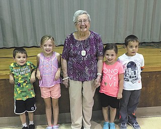 Poland Union Elementary continued its decade-long tradition of hosting visitors from the Sunrise Senior Living of Poland. Alice Colella’s first-grade class welcomed a group of seniors Sept. 21. They shared milk and cookies, participated in a relay race, and celebrated Sunrise resident Kitty Sekula’s 90th birthday, at left. SPECIAL TO THE VINDICATOR
