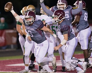 MICHAEL G TAYLOR | THE VINDICATOR- 10-14-16- 1st qtr, on bad 4th down snap on a punt attempt, Boardman's #9 Gaven Strines celebrates his recovery of the loose ball for a TD.  Ursuline Irish vs Boardman Spartans at Spartan Stadium in Boardman, OH.