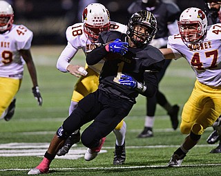 WARREN, OHIO - OCTOBER 14, 2016: Lynn Bowden #1 of Warren Harding reverses field away from Stephen VanSuch #18 and Andrew Hubert #47 of Mooney on a kickoff return during the first half of their game Friday nights game at Molenkamp Stadium. DAVID DERMER | THE VINDICATOR