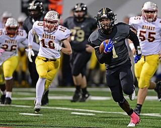 WARREN, OHIO - OCTOBER 14, 2016: Lynn Bowden #1 of Warren Harding runs to the corner of the end zone to score a touchdown after avoiding Vinny Santisi #55, Pat Pelini #10 and Andre McCoy #26 of Mooney during the first half of their game Friday nights game at Molenkamp Stadium. DAVID DERMER | THE VINDICATOR