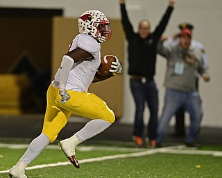 WARREN, OHIO - OCTOBER 14, 2016: Jaylen Hewlett #9 of Mooney runs with the football into the end zone to score a touchdown after recovering a Lynn Bowden #1 of Warren Harding (not pictured) fumble late in the first half of their game Friday nights game at Molenkamp Stadium. DAVID DERMER | THE VINDICATOR