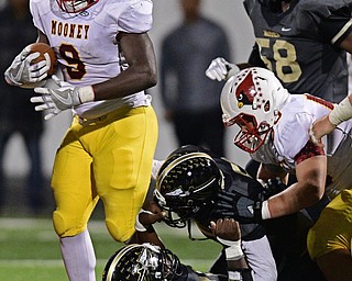 WARREN, OHIO - OCTOBER 14, 2016: Jaylen Hewlett #9 of Mooney fights for extra yardage between the tackles during the second half of their game Friday nights game at Molenkamp Stadium. DAVID DERMER | THE VINDICATOR