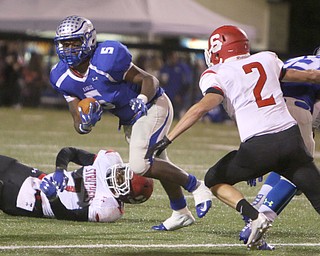 Hubbard's Rafael Morales (5) tries to get to the outside of Struthers defender Nick Adams (2) during the second quarter of Friday nights matchup at Hubbard High School.  Dustin Livesay  |  The Vindicator  10/14/16 Hubbard