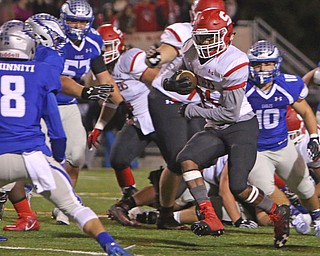 Struthers running back Regal Reese (21) looks to outrun Hubbard's Ray Minniti (8) during the second quarter of Friday nights matchup at Hubbard High School.  Dustin Livesay  |  The Vindicator  10/14/16 Hubbard