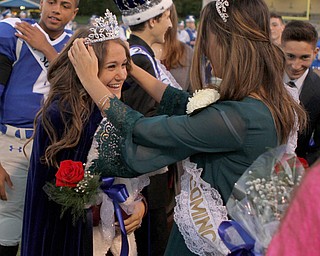 Alaina Colella (left) gets crowned homecoming queen by 2015 homecoming queen Lauren Cooper during the pregame ceremony of the Struthers vs Hubbard matchup at Hubbard High School.  Dustin Livesay  |  The Vindicator  10/14/16  Hubbard.