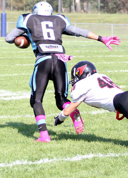 Nikos Frazier | The Vindicator..East's Maurice Pickard(6) returns the 1st quarter kickoff as Canfield's Laurence Bucciarelli(48) attempts to tackle him at Rayen Stadium in Youngstown on Saturday, Oct. 15, 2016 as the Canfield Cardinals take on the East Panthers. (Nikos Frazier / KSU-JMC)