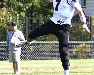 Nikos Frazier | The Vindicator..Canfield quarterback Jake Cummings(7) jumps into the air before the throw in the first half at Rayen Stadium in Youngstown on Saturday, Oct. 15, 2016 as the Canfield Cardinals take on the East Panthers.