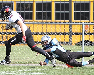 Nikos Frazier | The Vindicator..East's Jamaun Bryant(1) attempts to take down Canfield's Duncan DiGiacomo(19) as he crosses into East's goal line at Rayen Stadium in Youngstown on Saturday, Oct. 15, 2016 as the Canfield Cardinals take on the East Panthers.