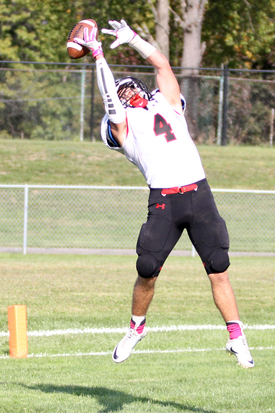 Nikos Frazier | The Vindicator..Canfield's Paul Breinz(4) jumps in the end zone as the ball narrowly misses his grasp in the second quarter at Rayen Stadium in Youngstown on Saturday, Oct. 15, 2016 as the Canfield Cardinals take on the East Panthers.