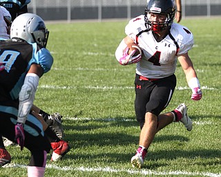 Nikos Frazier | The Vindicator..Canfield's Paul Breinz(4) runs the ball in the second quarter at Rayen Stadium in Youngstown on Saturday, Oct. 15, 2016 as the Canfield Cardinals take on the East Panthers.Nikos Frazier | The Vindicator..