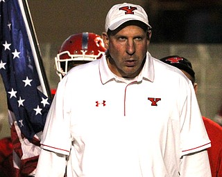 Nikos Frazier | The Vindicator..YSU Head coach, Bo Pelini walks onto the field before the first quarter as Youngstown State takes on Northern Illinois at Stambaugh Stadium in Youngstown on Saturday, Oct. 15, 2016.