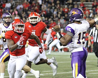 Nikos Frazier | The Vindicator..UNI quarterback, Aaron Bailey winds up in the first quarter as Youngstown State takes on Northern Illinois at Stambaugh Stadium in Youngstown on Saturday, Oct. 15, 2016.