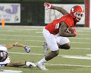 Nikos Frazier | The Vindicator..YSU's Alvin Bailey(5) excapes UNI's defense in the second quarter as Youngstown State takes on Northern Illinois at Stambaugh Stadium in Youngstown on Saturday, Oct. 15, 2016.