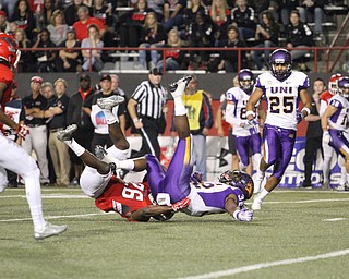 Nikos Frazier | The Vindicator..UNI's Tyvis Smith(32) is brought down by YSU's Jameel Smith(26) in the second quarter as Youngstown State takes on Northern Illinois at Stambaugh Stadium in Youngstown on Saturday, Oct. 15, 2016.