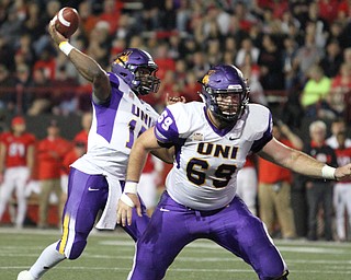 Nikos Frazier | The Vindicator..UNI quarterback, Aaron Bailey(15) winds up in the second quarter as Youngstown State takes on Northern Illinois at Stambaugh Stadium in Youngstown on Saturday, Oct. 15, 2016.