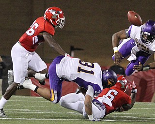 Nikos Frazier | The Vindicator..The ball is launched into the air in the second quarter as Youngstown State takes on Northern Illinois at Stambaugh Stadium in Youngstown on Saturday, Oct. 15, 2016. ..In the air: YSU Jameel Smith(26) and UNI Aaron Bailey(15).On the ground: UNI Michael Malloy(31) and YSU Jamar Pinnock(6)