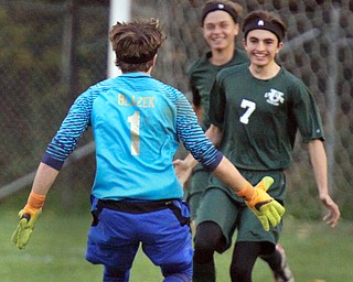 William D. Lewis The Vindicator Ursuline's Nick Beike(7) gets congrats from Bryce Blazek(1) after scoring the 2nd goal against Mooney 10-18-16.
