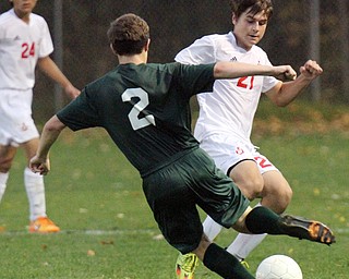 William D. Lewis The Vindicator Ursuline's Cody Rackoff (2) and Mooney's Jacob Mesaros(21) go for the ball during 10182016 action at Simon.