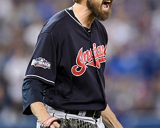Cleveland Indians relief pitcher Andrew Miller celebrates after Toronto Blue Jays' Josh Donaldson hit into an inning-ending double play during sixth inning during Game 5 of baseball's American League Championship Series in Toronto, Wednesday, Oct. 19, 2016. (Frank Gunn/The Canadian Press via AP)