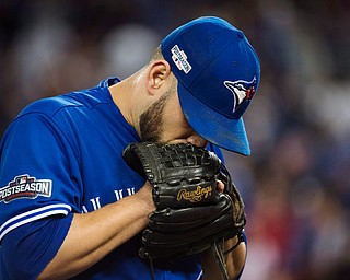 Toronto Blue Jays starting pitcher Marco Estrada (25) reacts on his way to the dugout during the third inning in Game 5 of baseball's American League Championship Series against the Cleveland Indians in Toronto, Wednesday, Oct. 19, 2016. (Nathan Denette/The Canadian Press via AP)