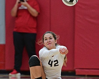 SALEM, OHIO - OCTOBER 19, 2016: Rae Dixon #42 of Columbiana goes low to bump the ball and keep it alive during their tournament game Wednesday night at Salem High School. Springfield won in three sets. DAVID DERMER | THE VINDICATOR