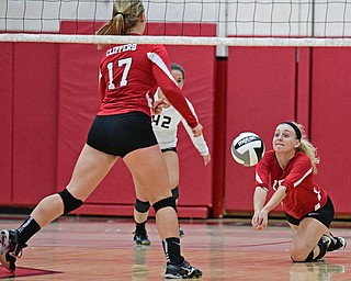 SALEM, OHIO - OCTOBER 19, 2016: Alexis Cross #18 of Columbiana goes low to bump the ball and keep it alive during their tournament game Wednesday night at Salem High School. Springfield won in three sets. DAVID DERMER | THE VINDICATOR