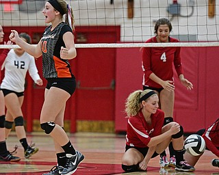 SALEM, OHIO - OCTOBER 19, 2016: Ellie Centofanti #10 of Springfield pumps her fists after a springfield point while Maddie Stryffler #4, Alexis Cross #18 and Lexi Wilkes #1 of Columbiana show their frustrations after allowing a Springfield point during their tournament game Wednesday night at Salem High School. Springfield won in three sets. DAVID DERMER | THE VINDICATOR