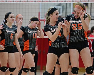 SALEM, OHIO - OCTOBER 19, 2016: Makenzy Capouellez #4 (right) and Mariah Johnson #25 (left) of Springfield celebrate after defeating Columbiana in their tournament game Wednesday night at Salem High School. Springfield won in three sets. DAVID DERMER | THE VINDICATOR