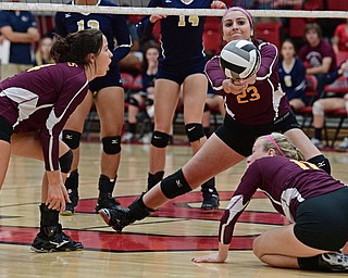 SALEM, OHIO - OCTOBER 19, 2016: Taylor Naples #18 of South Range keeps the ball alive after teammates Codi Taylor #11 and Gracie Hiner #14 could not get to the ball in time during their tournament game Wednesday night at Salem High School. DAVID DERMER | THE VINDICATOR