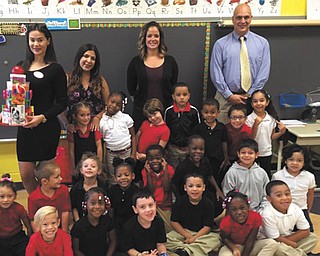 SPECIAL TO THE VINDICATOR
Maria Perez, winner of Today’s International Woman Pageant, donated school supplies to Miss Gonzalez’s kindergarten class at Campbell City School on Sept. 22. Perez represented the state of Ohio during the pageant, which was hosted on a cruise ship in the Bahamas. She was crowned Queen of Queens and is the first woman from Puerto Rico to win the event. She is now participating in community service. Her son, Jadriel, also was crowned King of Kids in the pageant. Sitting, in front from left, are Jadriel, Jamesha, Iakovos, Robby, C’Asia and Joab; kneeling in the second row are Isabella, Julian, Sophia, KaMarra, Edward, Carvell, Aizaiah and Janeydie; in the third row are LeAunna, Guionna, Tatiana, Kevin, Mason, Yasseph and Noor; and in the fourth row are Perez, Gonzalez, Literacy Collaborative Coach Mrs. McDougal and Mr. Klingensmith, principal.
