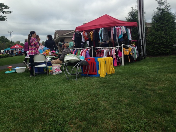 Neighbors | Alexis Bartolomucci.Tents that were set up sold clothing, toys and other items for children at the Baby Bargain Boutique sale at Boardman Park on Sept. 24.